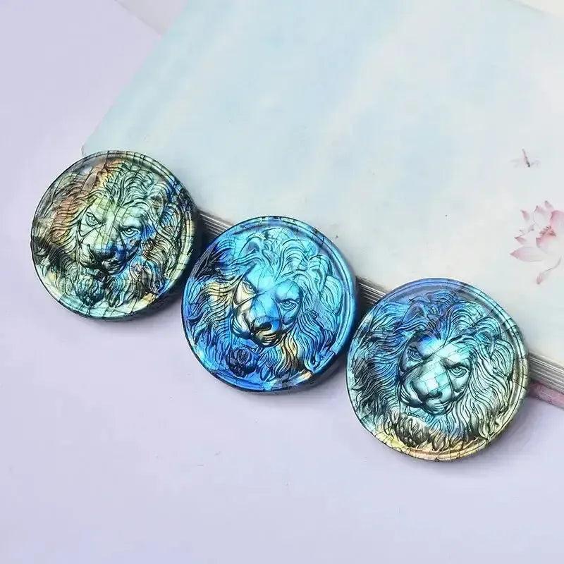 Three iridescent Labradorite lion carvings, radiating courage and transformation, from the Growth & Transformation Crystal Bundle.