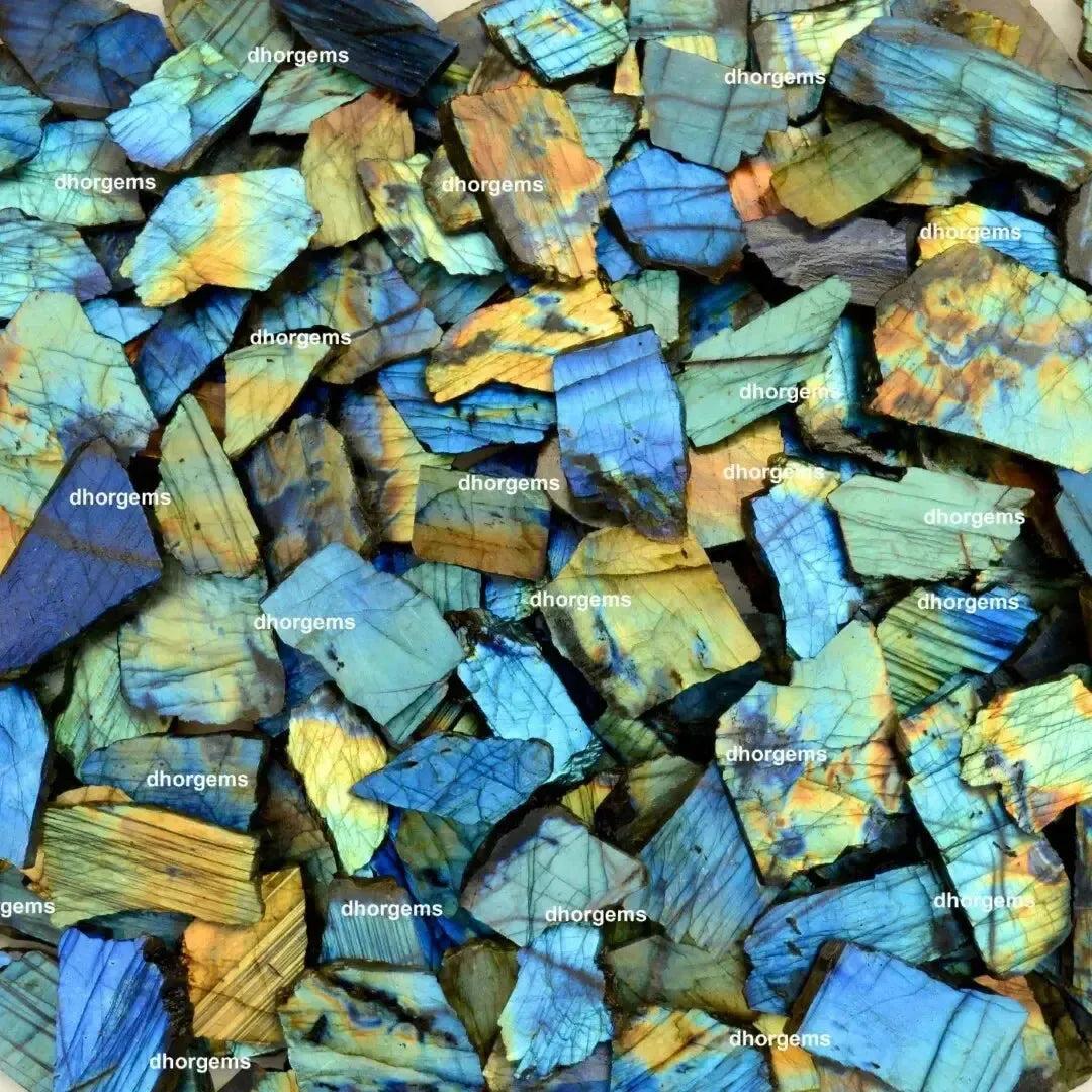 Vibrant blue, green, and gold raw labradorite crystal pieces from Crystal Destiny, known for transformation and magic.