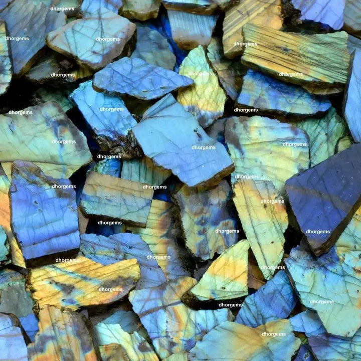 Raw labradorite multi-fire slab pieces from Crystal Destiny, showing vibrant blue, gold, and green labradorescence.