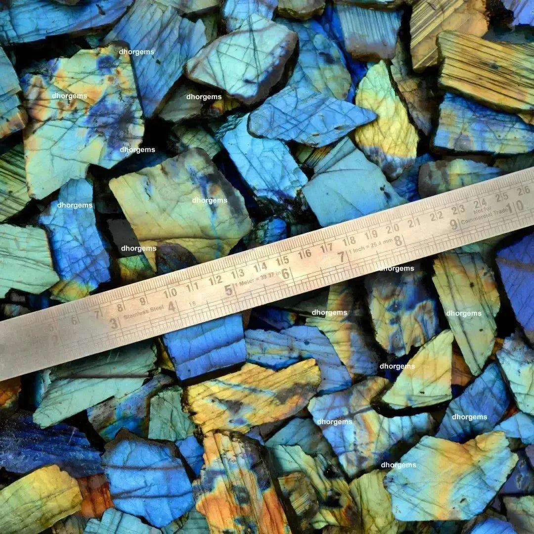 Crystal Destiny's raw labradorite multi-fire slabs with vibrant blue, green, and gold flash, measured for size.