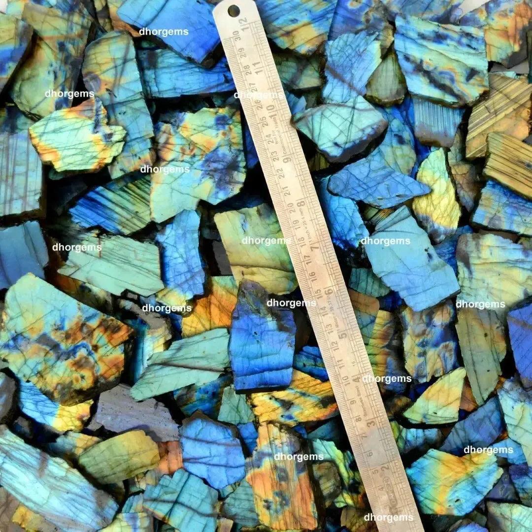 Crystal Destiny's raw labradorite slabs with vibrant blue, green, and gold flash, showing natural labradorescence.