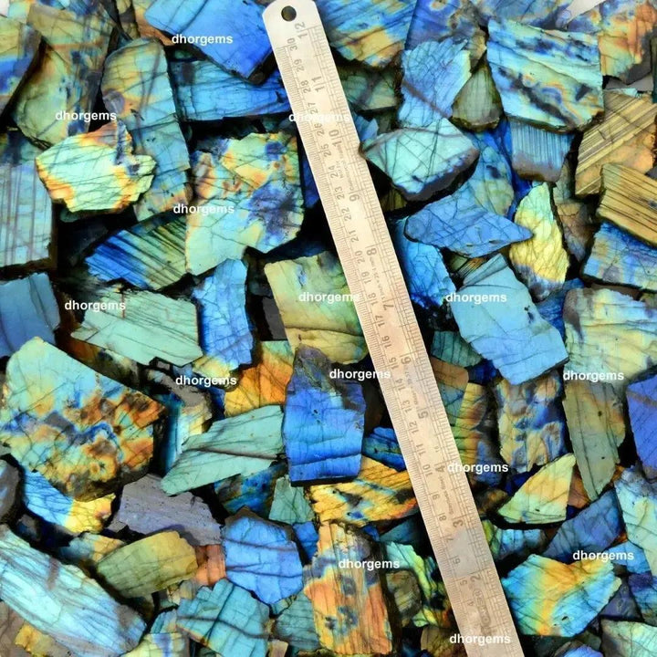 Crystal Destiny's raw labradorite slabs with vibrant blue, green, and gold flash, showing natural labradorescence.