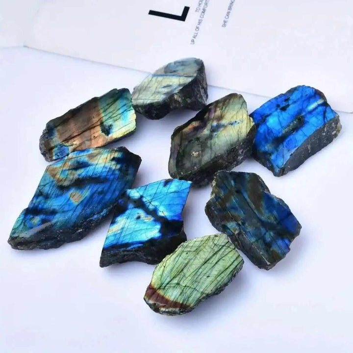 Natural rough Labradorite stone slices featuring vibrant blue and green iridescent flashes for Feng Shui decor.