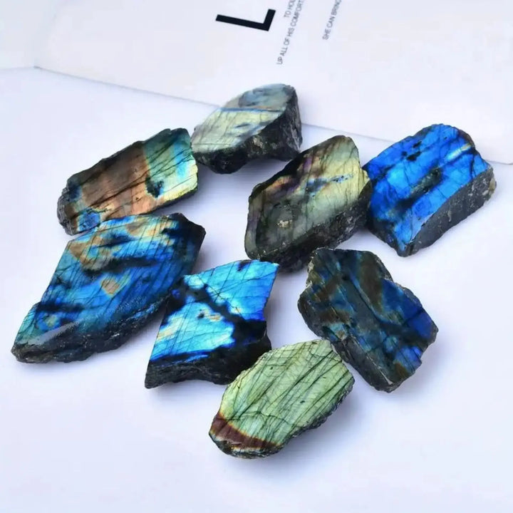 Natural rough Labradorite stone slices featuring vibrant blue and green iridescent flashes for Feng Shui decor.