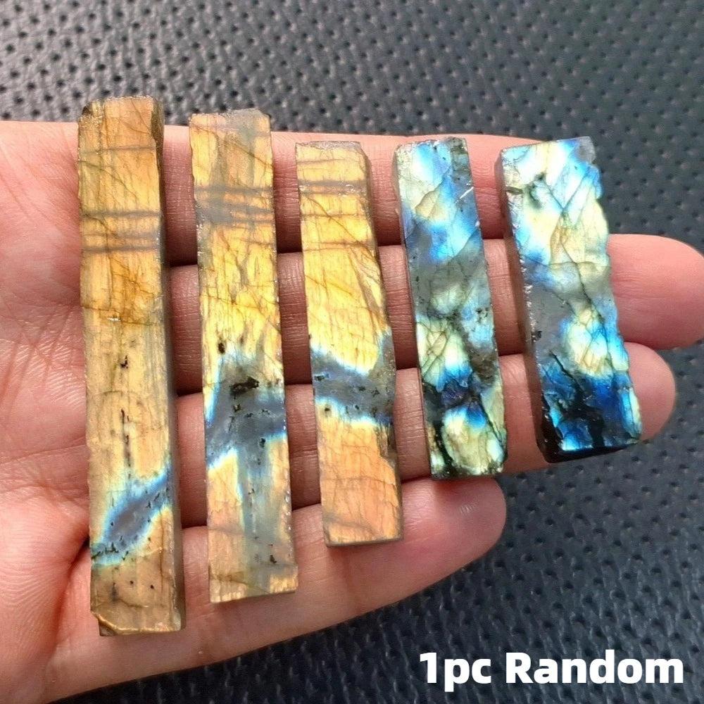 Raw labradorite crystal sticks featuring vibrant blue and gold spectral flashes for Third Eye Chakra transformation.