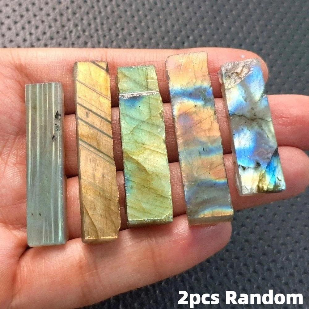 Raw Labradorite crystal sticks featuring vibrant blue, gold, and green spectral flashes for Third Eye Chakra healing.