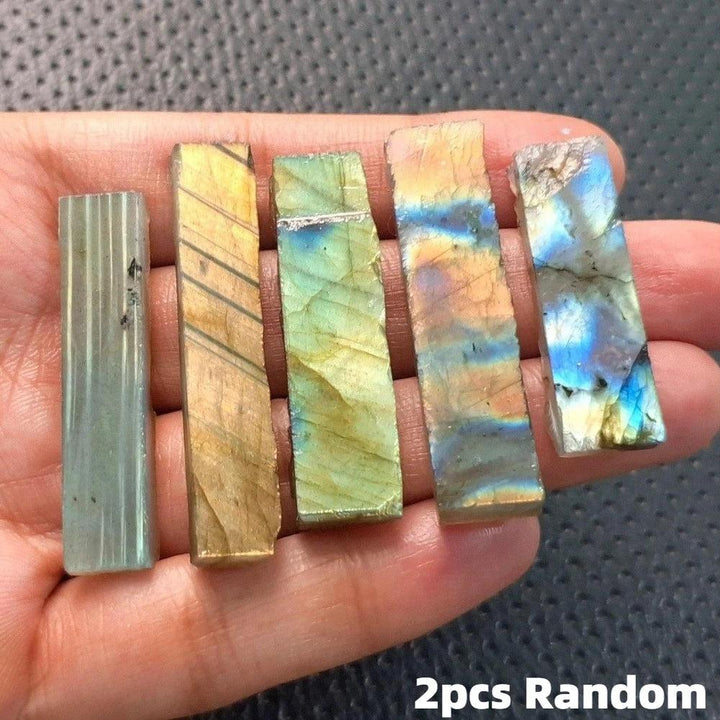 Raw Labradorite crystal sticks featuring vibrant blue, gold, and green spectral flashes for Third Eye Chakra healing.