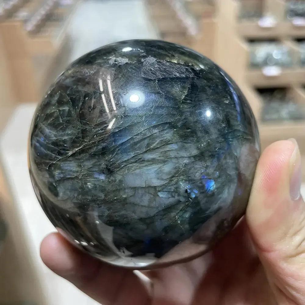 Polished Labradorite sphere from Crystal Destiny, showcasing iridescent blues, greens, and golds for intuition and protection.