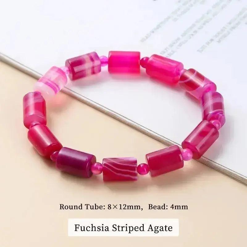 Fuchsia Striped Agate bracelet with polished round tube beads (8x12mm) and 4mm accent beads, promoting balance and calm.