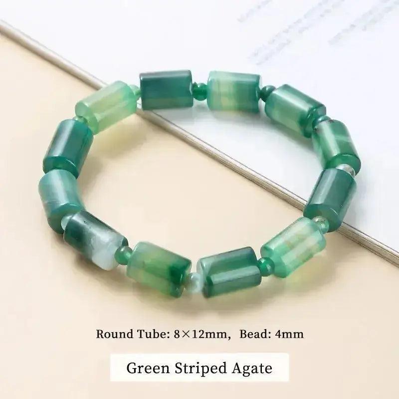 Green Striped Agate bracelet with polished tube beads and small round beads, promoting balance and calm energy.
