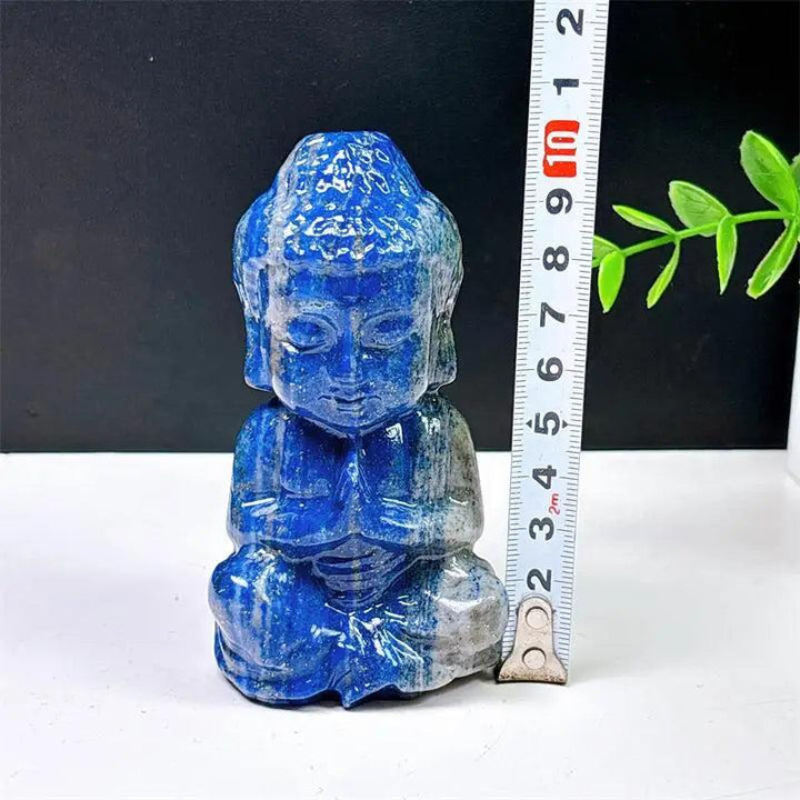 Hand-carved Lapis Lazuli Buddha meditation statue with deep blue color and gold pyrite for peace and Third Eye healing.