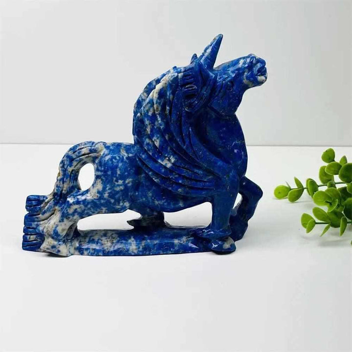Hand-carved Lapis Lazuli unicorn figurine with polished blue and white stone for healing and elegant home decor.