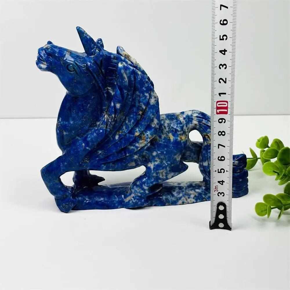 Hand-carved lapis lazuli unicorn figurine, a polished blue crystal healing sculpture for elegant home decor and Fengshui.