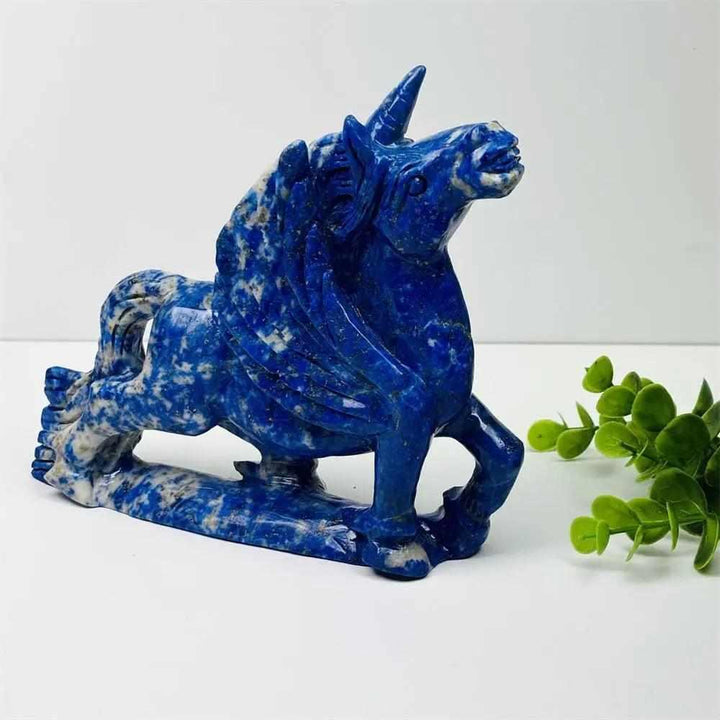 Polished lapis lazuli unicorn figurine, a vibrant blue healing crystal carving perfect for elegant home decor.