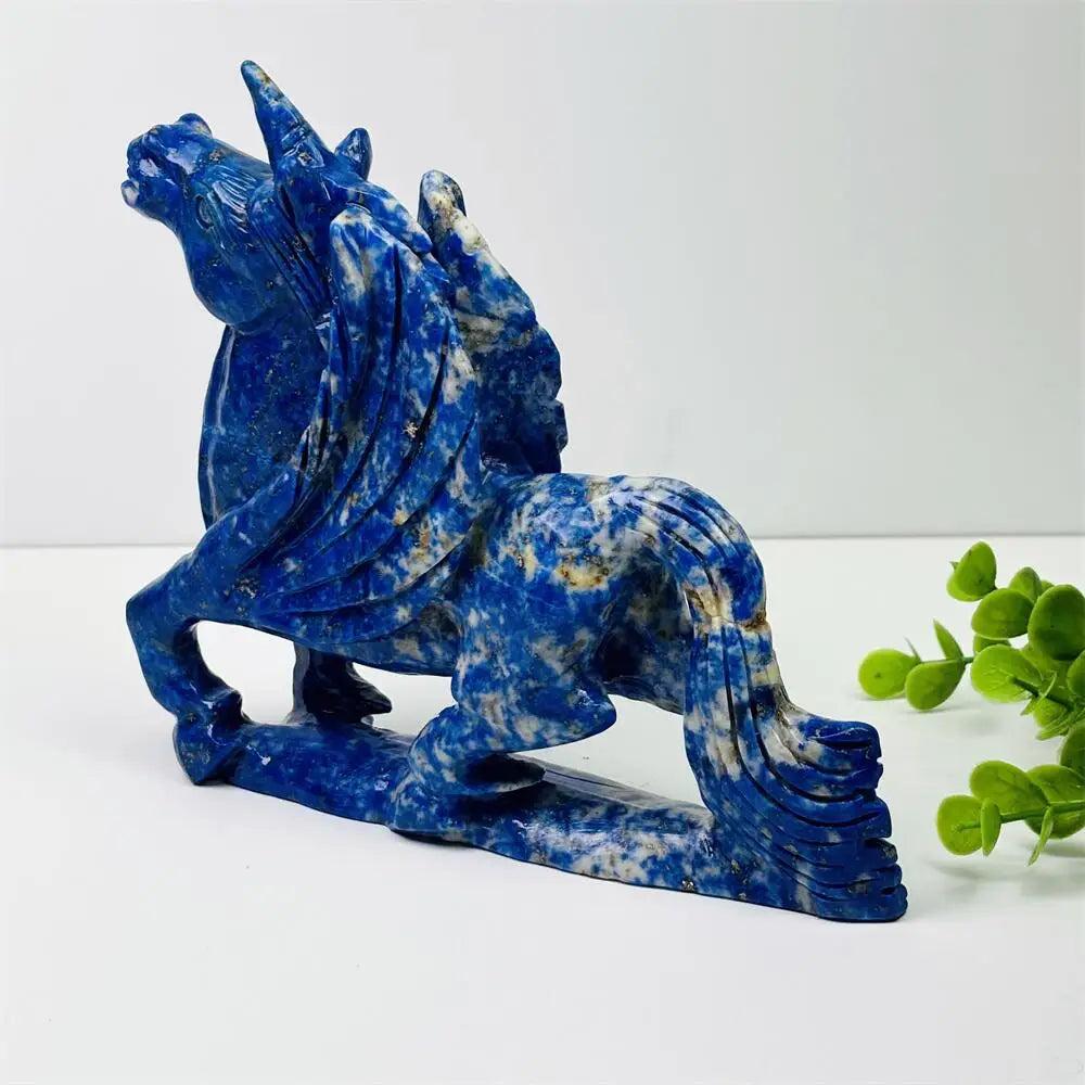 Polished lapis lazuli unicorn figurine, a hand-carved healing crystal sculpture with deep blue hues for home decor.