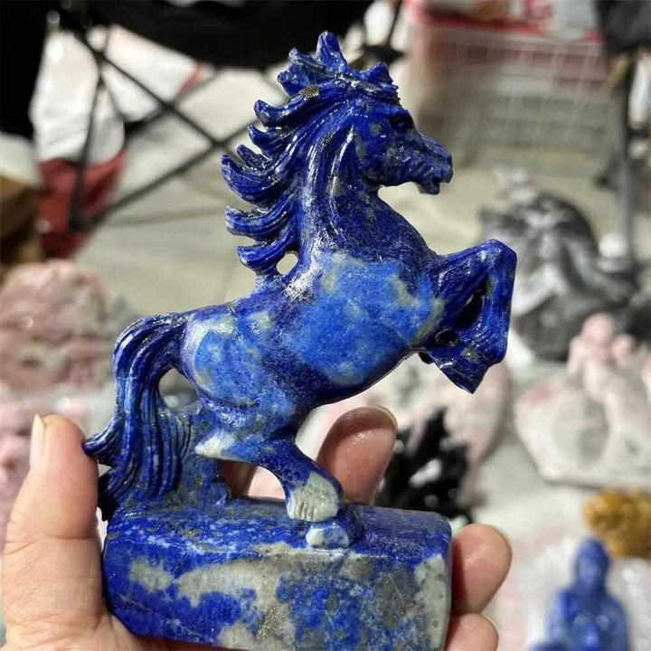 Hand-carved Lapis Lazuli unicorn crystal figurine, a polished blue healing stone perfect for home decor and reiki energy.