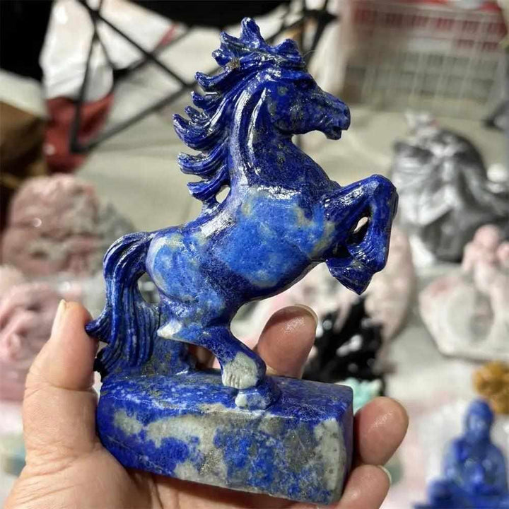 Hand-carved Lapis Lazuli unicorn crystal figurine, a polished blue healing stone perfect for Fengshui home decor and gifts.