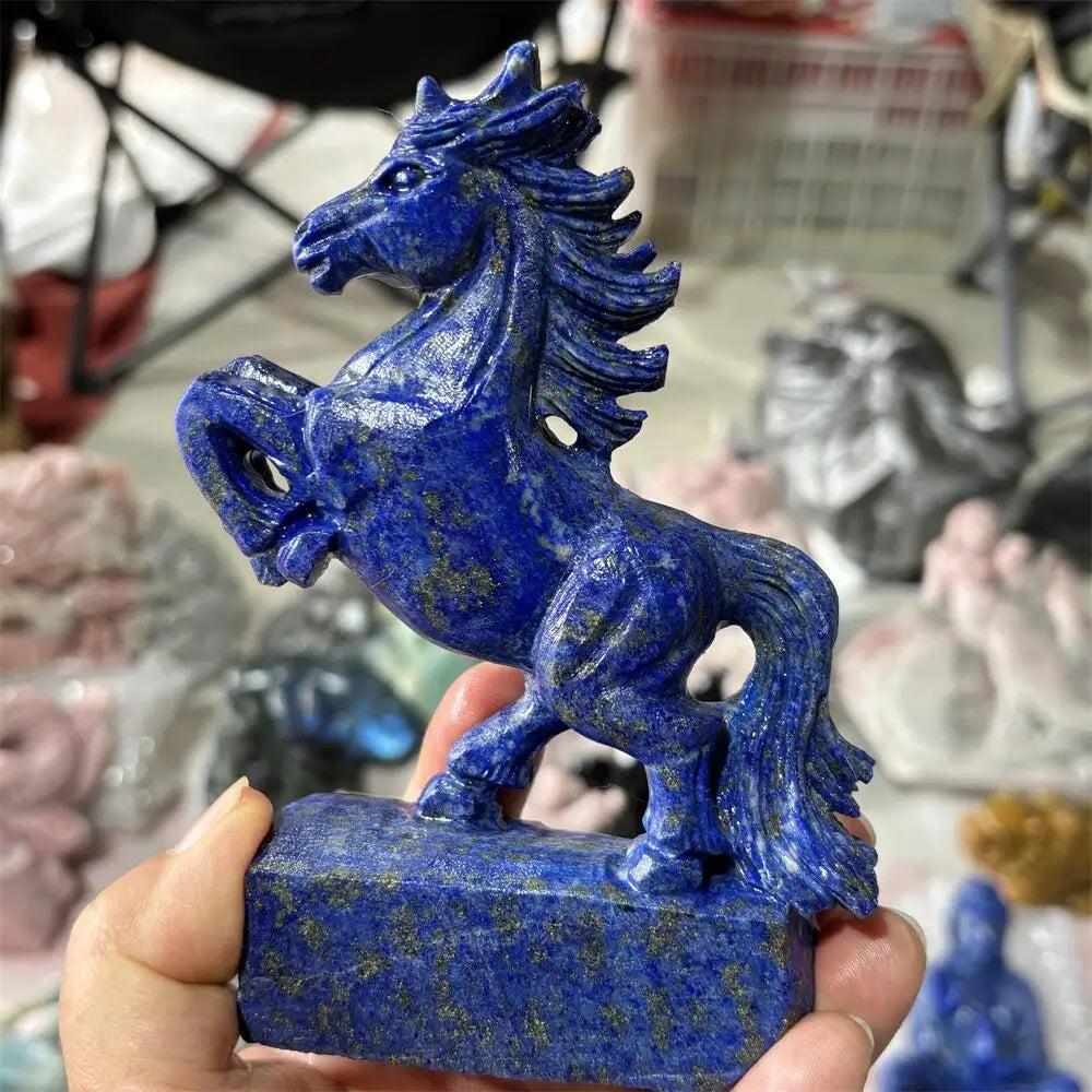 Hand-carved Lapis Lazuli unicorn healing stone with deep blue hues and gold flecks, perfect for home decor and Reiki.