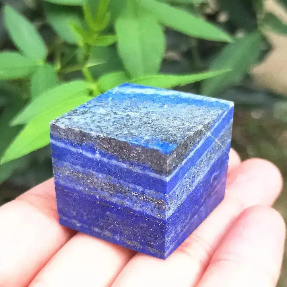 Deep blue Lapis Lazuli crystal cube paperweight with natural pyrite flecks, promoting wisdom and truth.