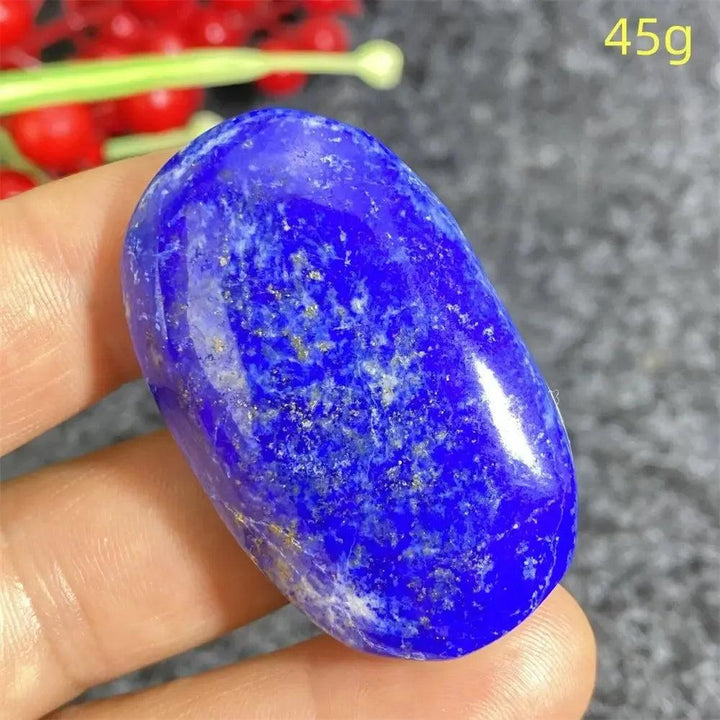 Lapis Lazuli Crystal Heart, a deep royal blue, hand-polished stone with golden pyrite flecks, enhancing intuition.