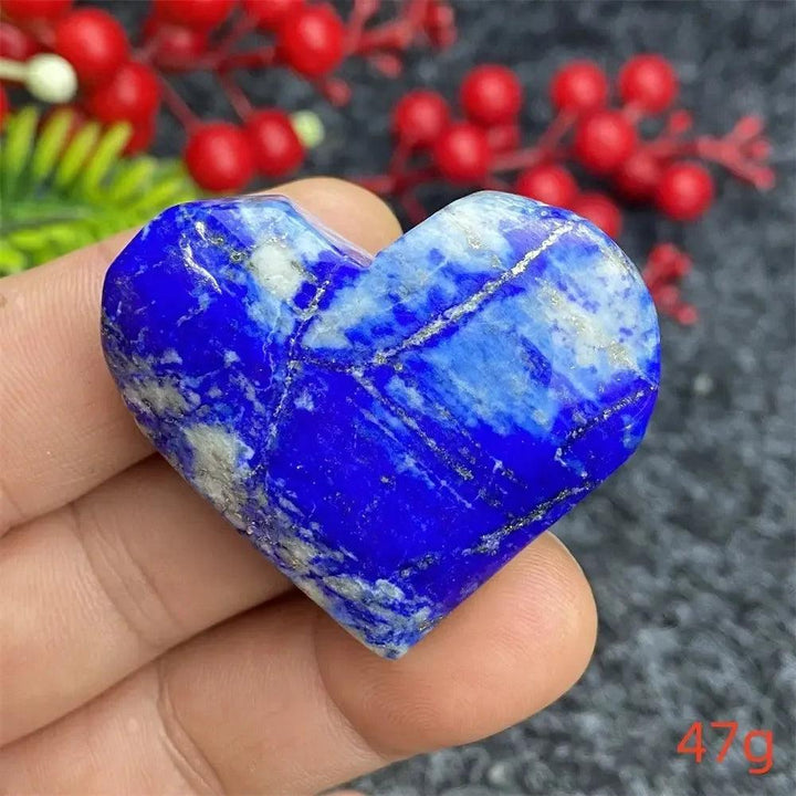 Hand-polished Lapis Lazuli Crystal Heart, deep royal blue with golden pyrite flecks, enhancing intuition and truth.