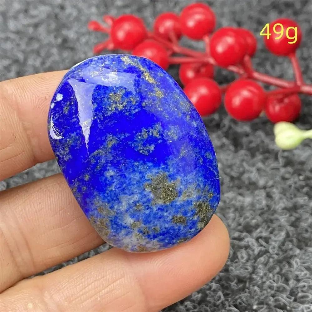 Hand-polished Lapis Lazuli Crystal Heart, deep royal blue with golden pyrite flecks, enhancing intuition and truth.