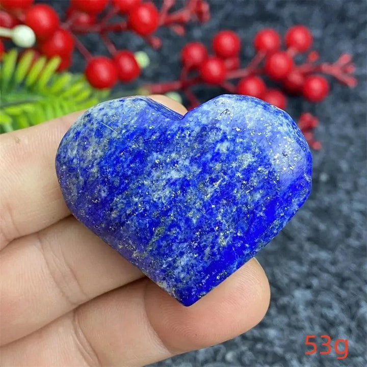 Hand-polished Lapis Lazuli Crystal Heart, deep royal blue with golden pyrite flecks, enhancing intuition and truth.