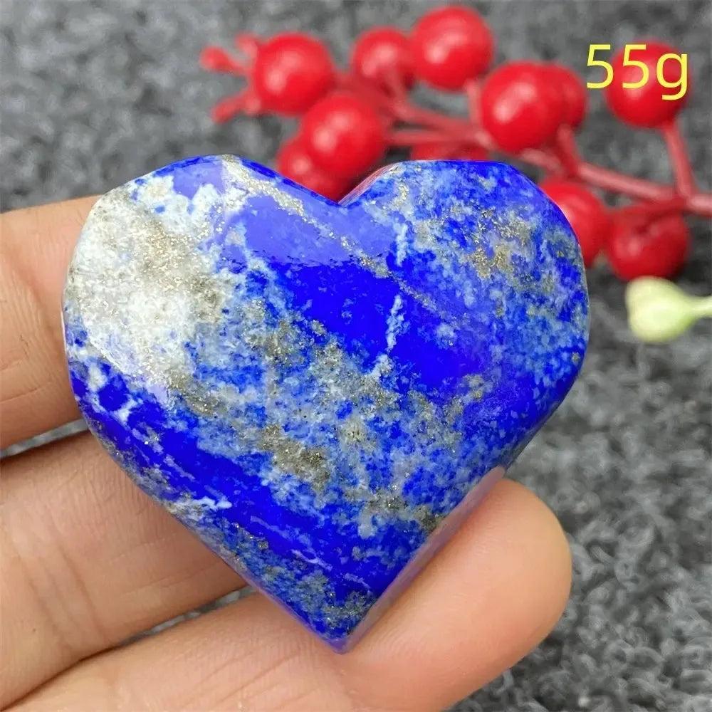 Hand-polished Lapis Lazuli Crystal Heart, deep royal blue with golden pyrite flecks, enhancing intuition and truth.