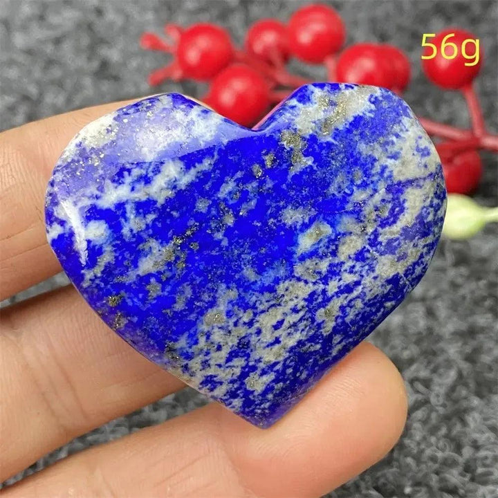 Hand-polished Lapis Lazuli Crystal Heart, deep royal blue with golden pyrite flecks, enhancing intuition and truth.