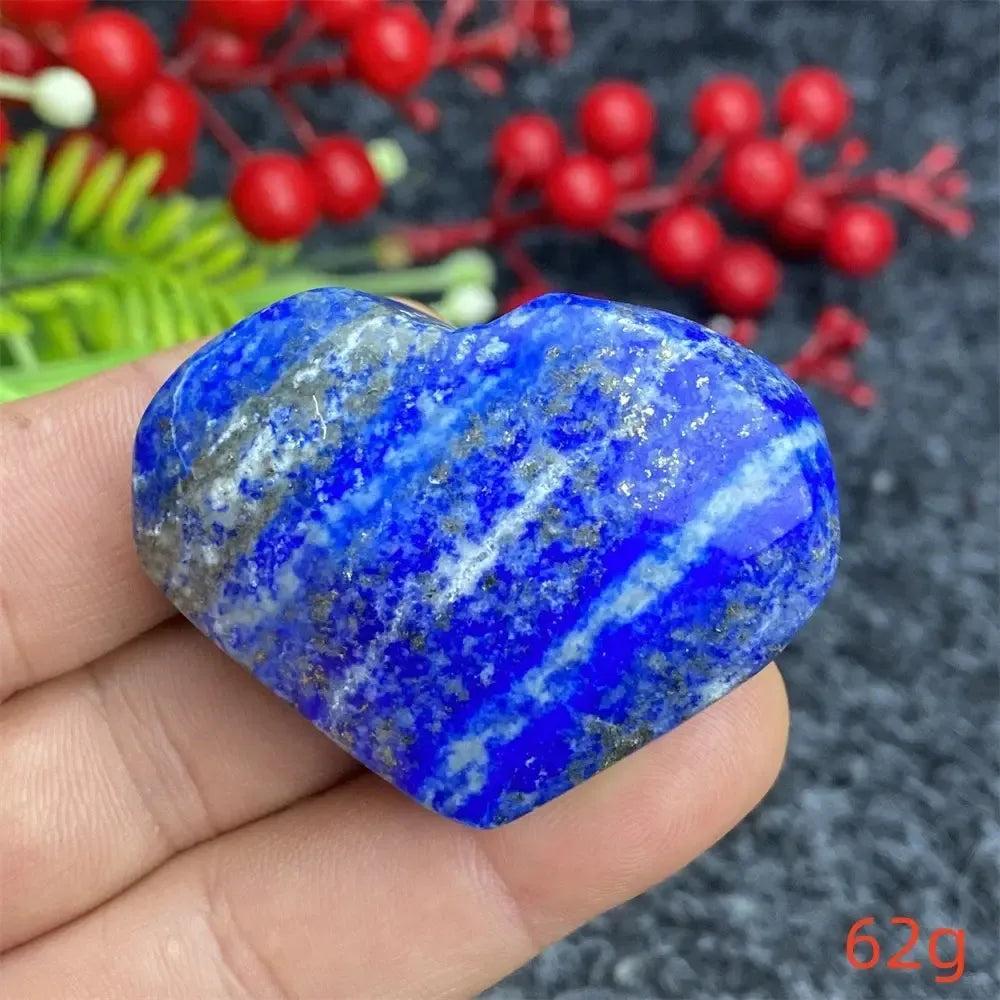 Hand-polished Lapis Lazuli Crystal Heart, deep royal blue with golden pyrite flecks, enhancing intuition and truth.