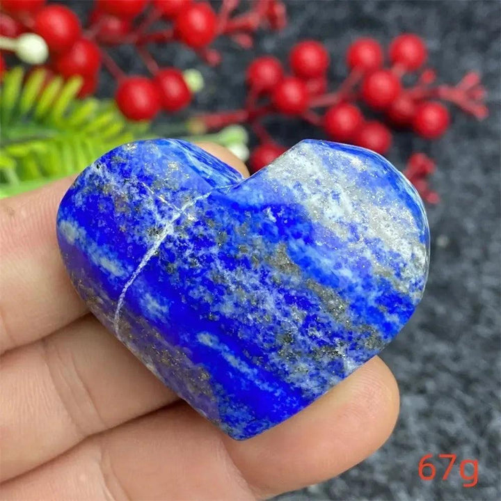 Hand-polished Lapis Lazuli Crystal Heart, deep royal blue with golden pyrite flecks, enhancing intuition and truth.