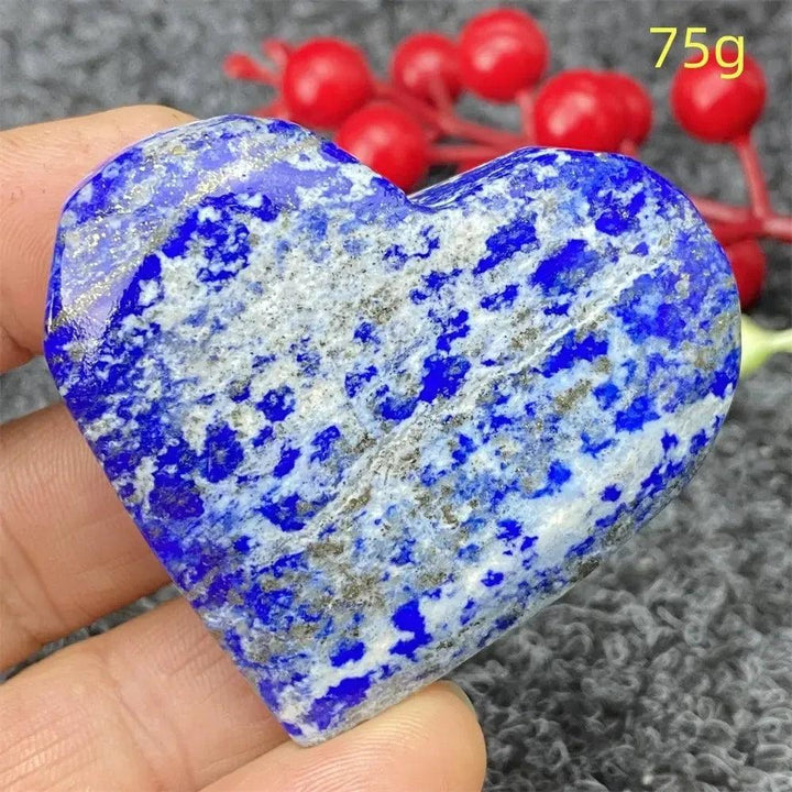 Hand-polished Lapis Lazuli Crystal Heart, deep royal blue with golden pyrite flecks, enhancing intuition and truth.