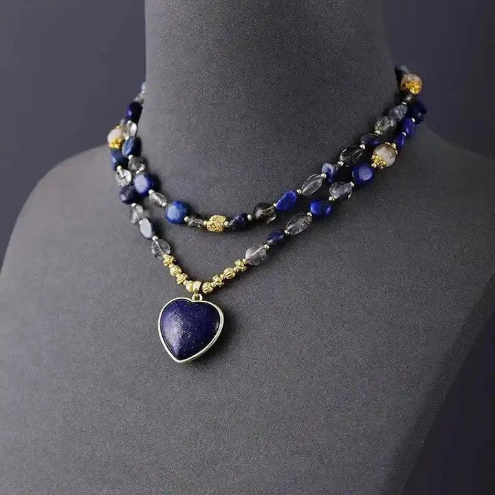 Deep blue Lapis Lazuli heart pendant lariat necklace with natural quartz and gold beads for wisdom and clarity.