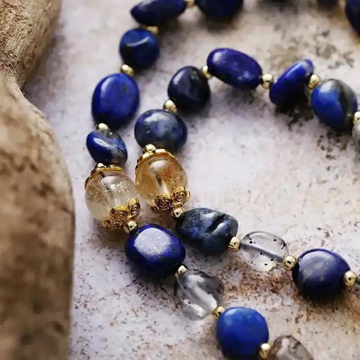 Lapis Lazuli Heart Pendant Lariat Necklace with deep blue Lapis, clear quartz, and golden accents.