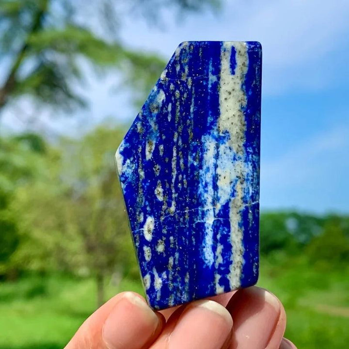 Polished royal blue Lapis Lazuli slab with golden pyrite flecks and white veins for healing energy.