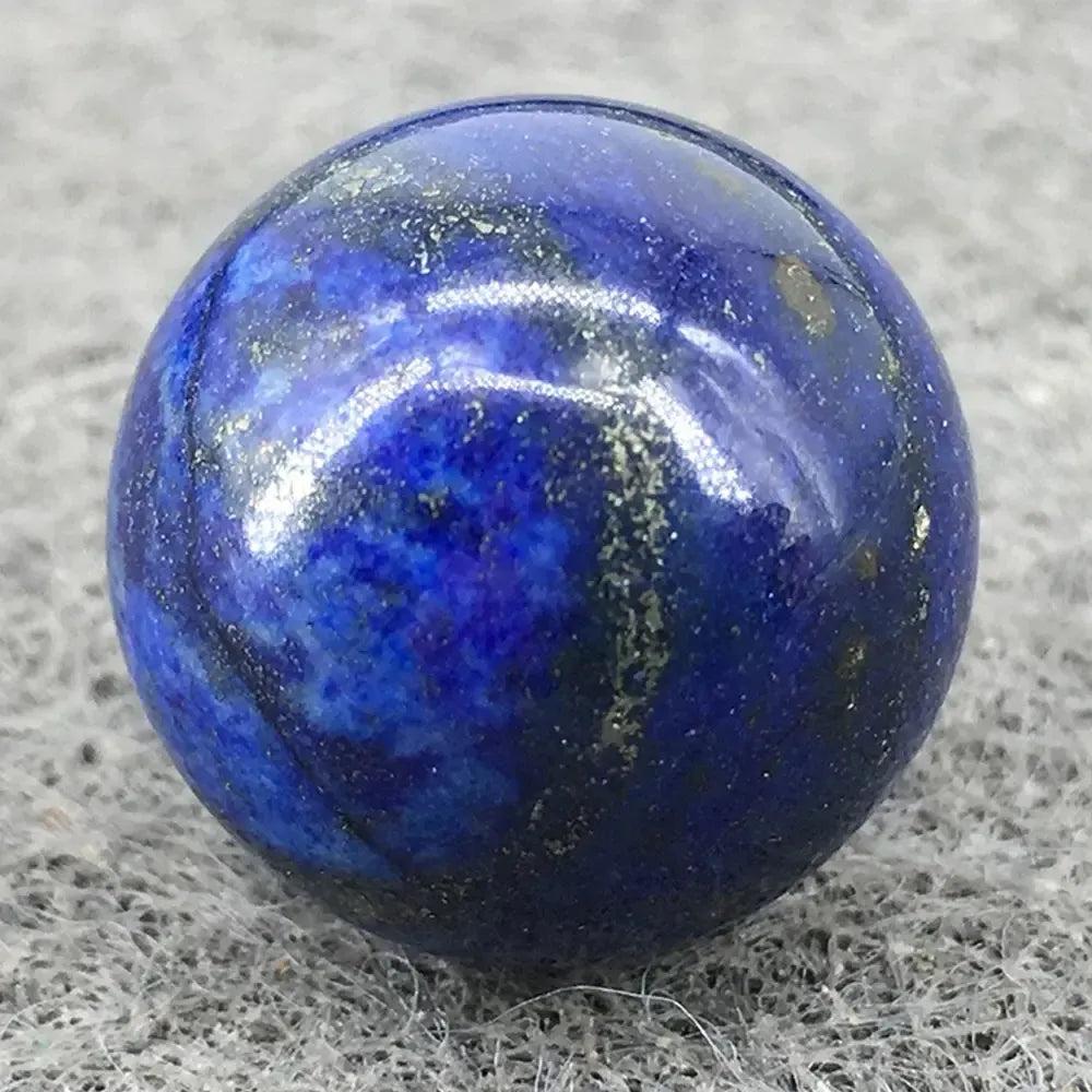Polished Lapis Lazuli Crystal Sphere, deep celestial blue with golden pyrite flecks, radiating wisdom and cosmic energy.
