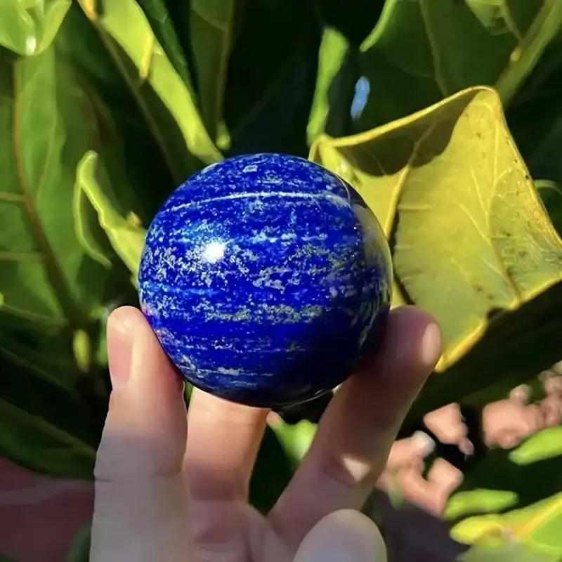 Polished Lapis Lazuli crystal sphere in deep royal blue with gold pyrite flecks, perfect for wisdom and intuition.