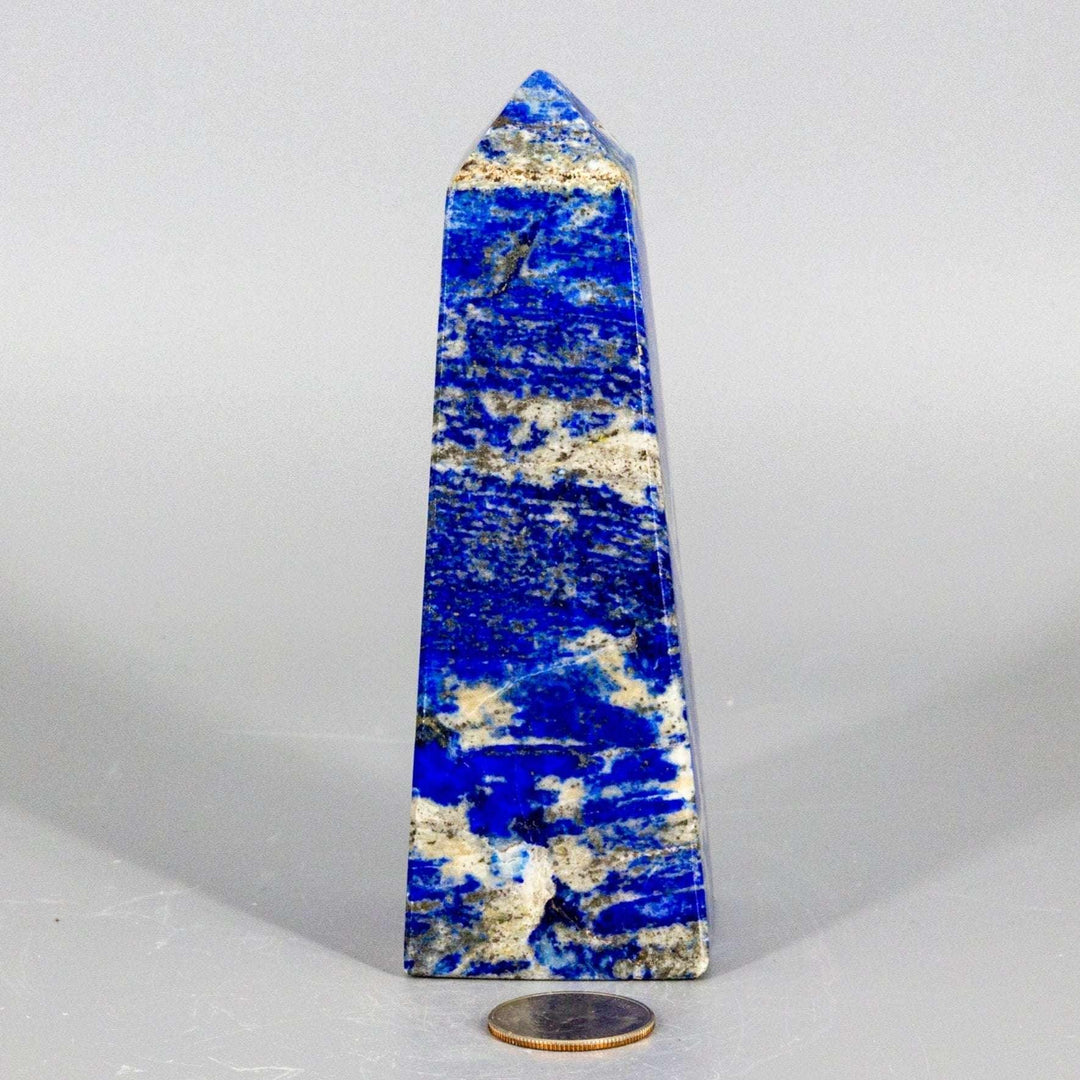 Large Lapis Lazuli Obelisk Tower, deep celestial blue with gold pyrite flecks, polished to enhance wisdom.