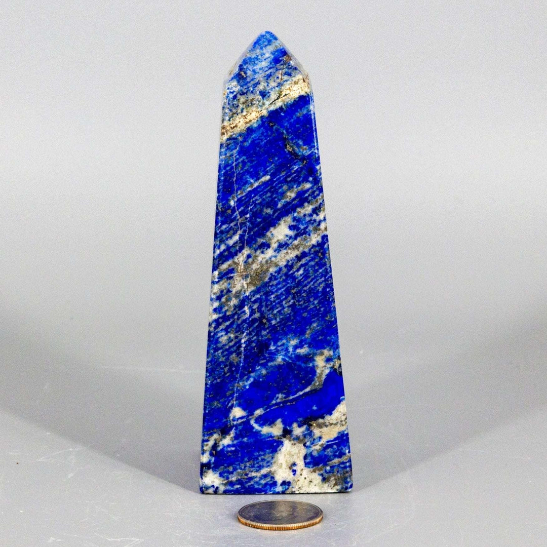 Large Lapis Lazuli Obelisk Tower, deep celestial blue with gold pyrite flecks, polished to enhance wisdom.