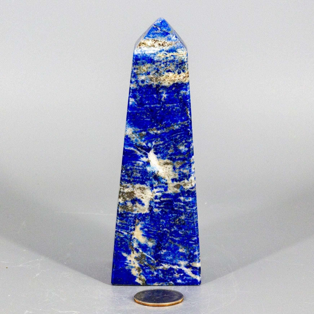 Large Lapis Lazuli Obelisk Tower, deep celestial blue with gold pyrite flecks, polished to enhance wisdom.