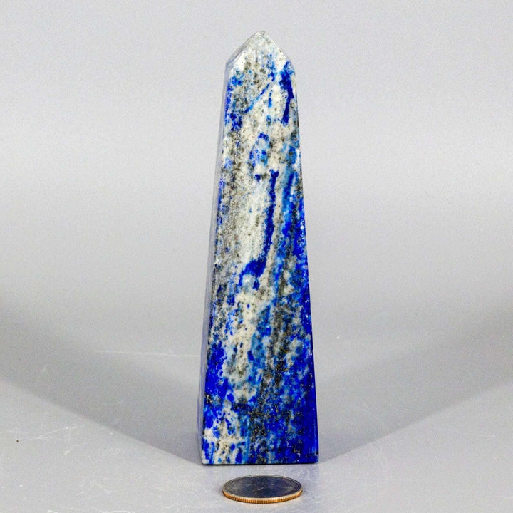Large Lapis Lazuli Obelisk Tower, deep celestial blue with gold pyrite flecks, polished to showcase its wisdom-enhancing energy.
