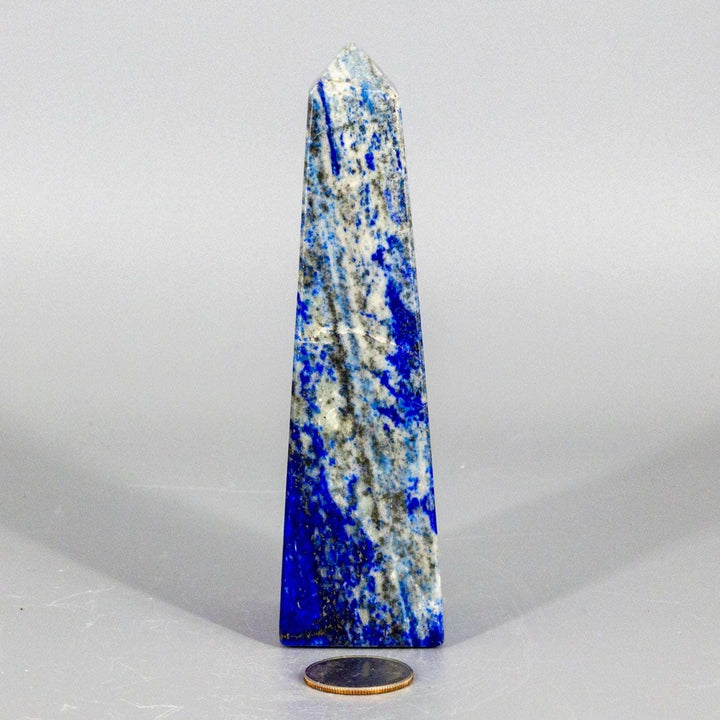 Large Lapis Lazuli Obelisk Tower, deep celestial blue with gold pyrite flecks, polished to enhance wisdom.