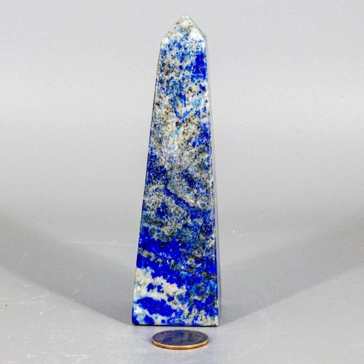Large Lapis Lazuli Obelisk Tower, deep celestial blue with gold pyrite flecks, polished to enhance wisdom.