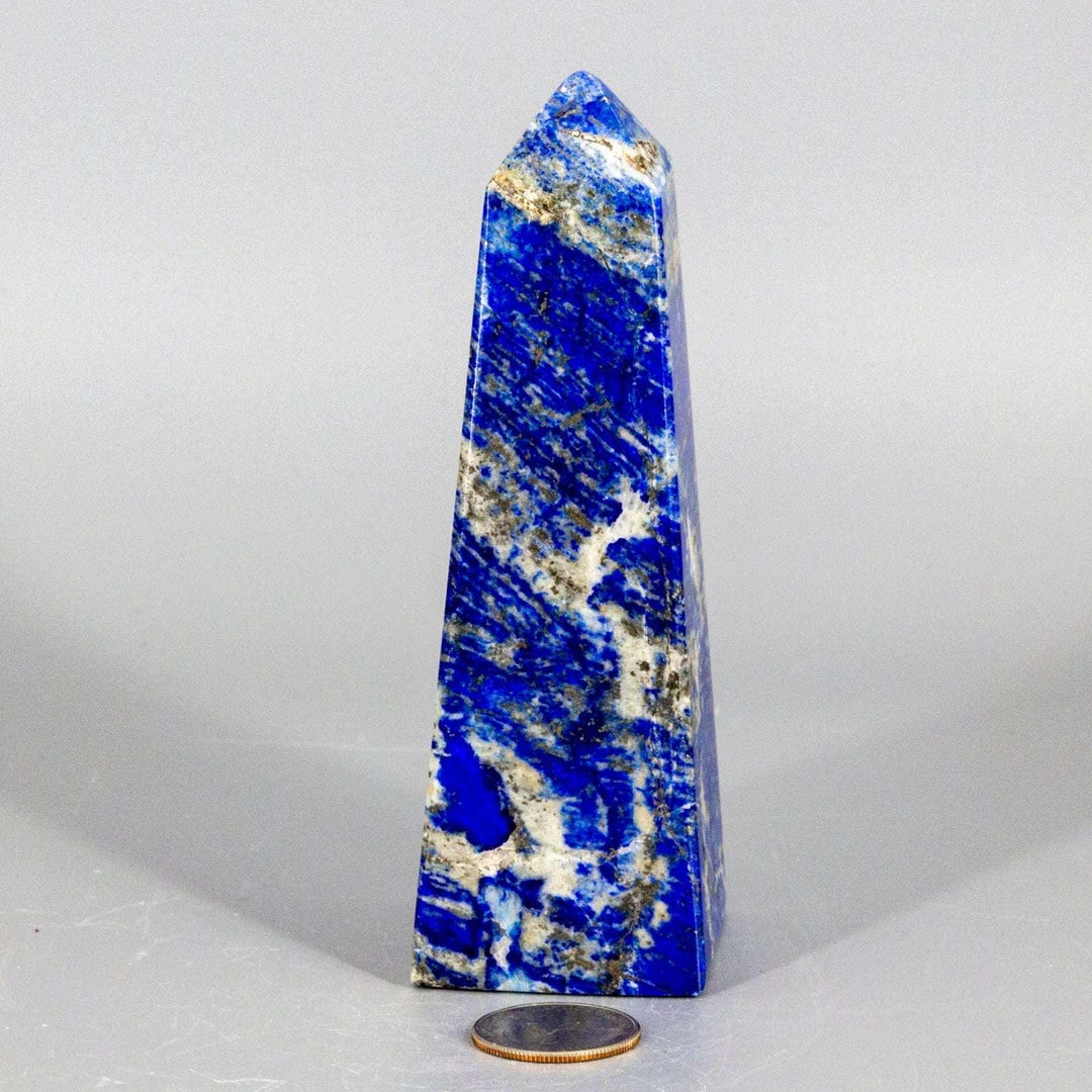Large Lapis Lazuli Obelisk Tower, deep celestial blue with gold pyrite flecks, polished to enhance wisdom.