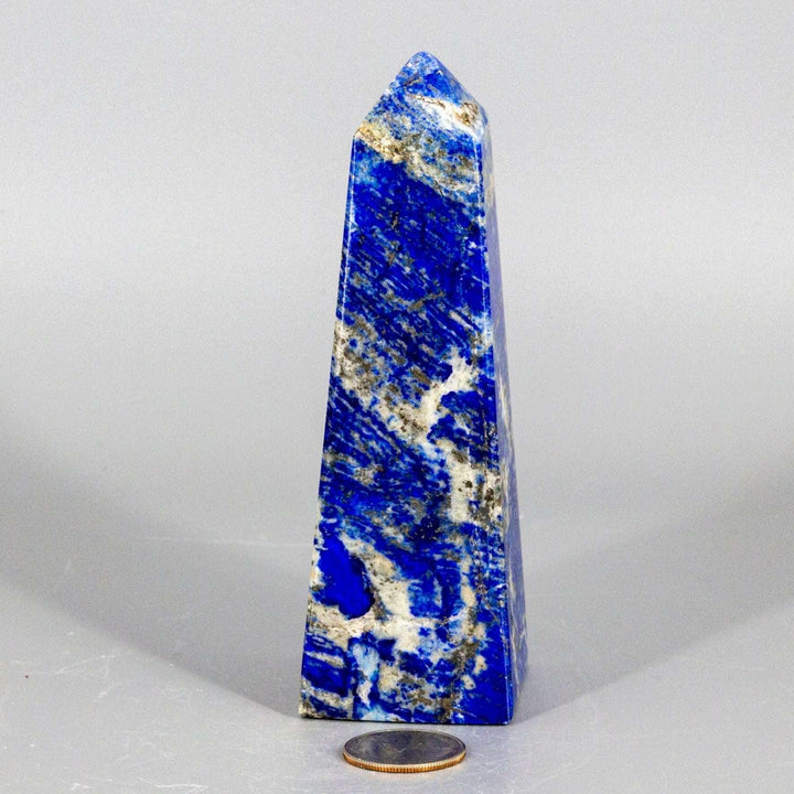 Large Lapis Lazuli Obelisk Tower, deep celestial blue with gold pyrite flecks, polished to enhance wisdom.