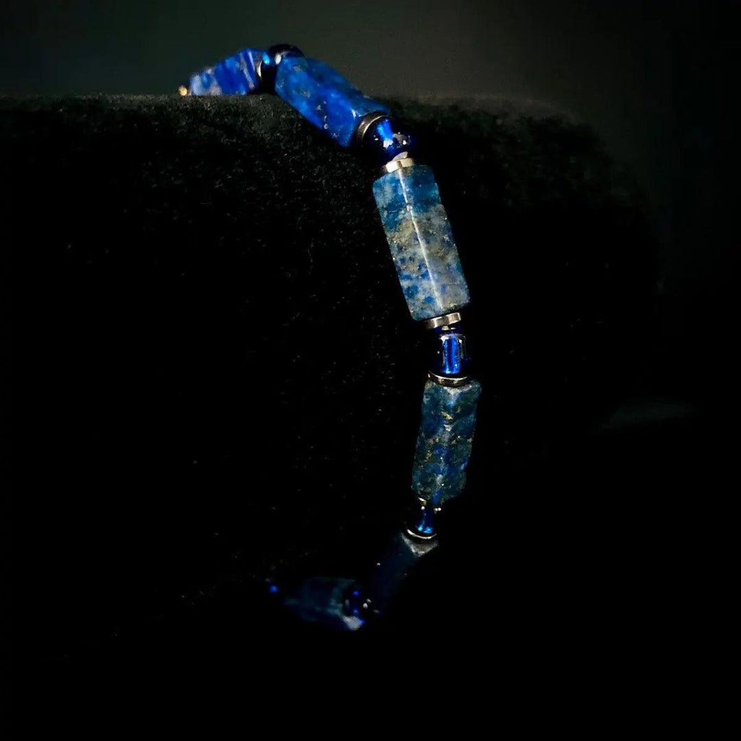 Lapis Lazuli square bead bracelet on elastic cord, featuring deep blue stones for Throat Chakra wisdom and reflection.