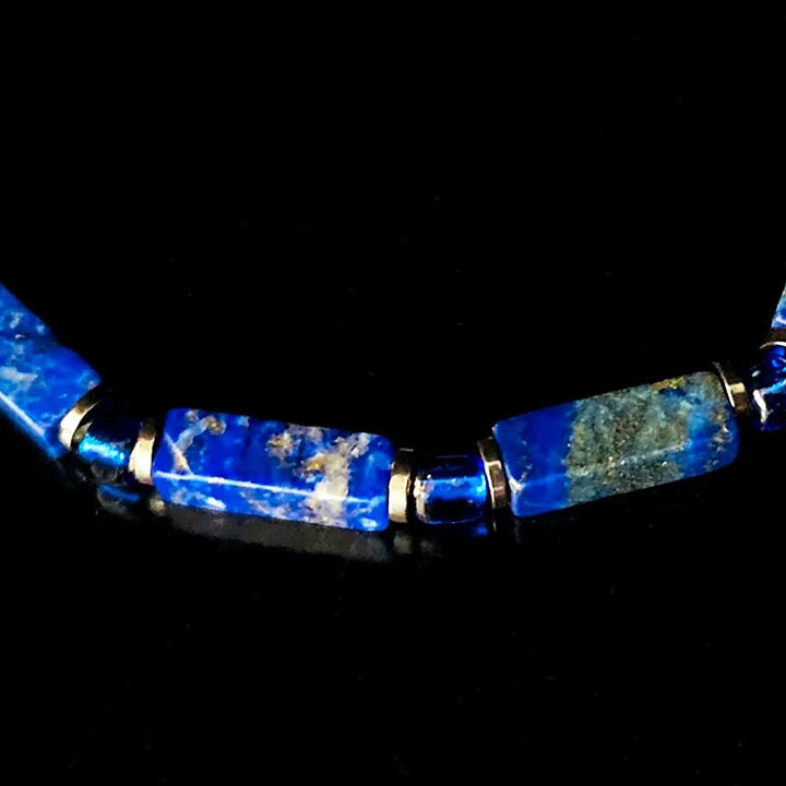 Lapis Lazuli square bead bracelet on elastic cord, featuring deep blue natural stone for Throat Chakra wisdom.