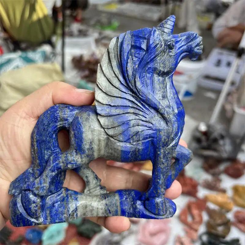 Hand-carved natural Lapis Lazuli unicorn statue, a vibrant blue and grey gemstone healing figurine.