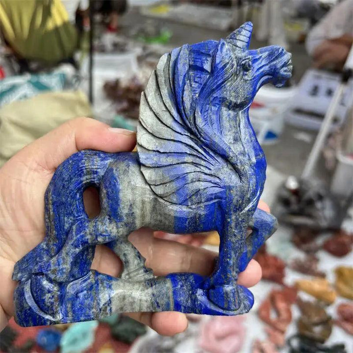 Hand-carved natural Lapis Lazuli unicorn statue, a vibrant blue and grey gemstone healing figurine.