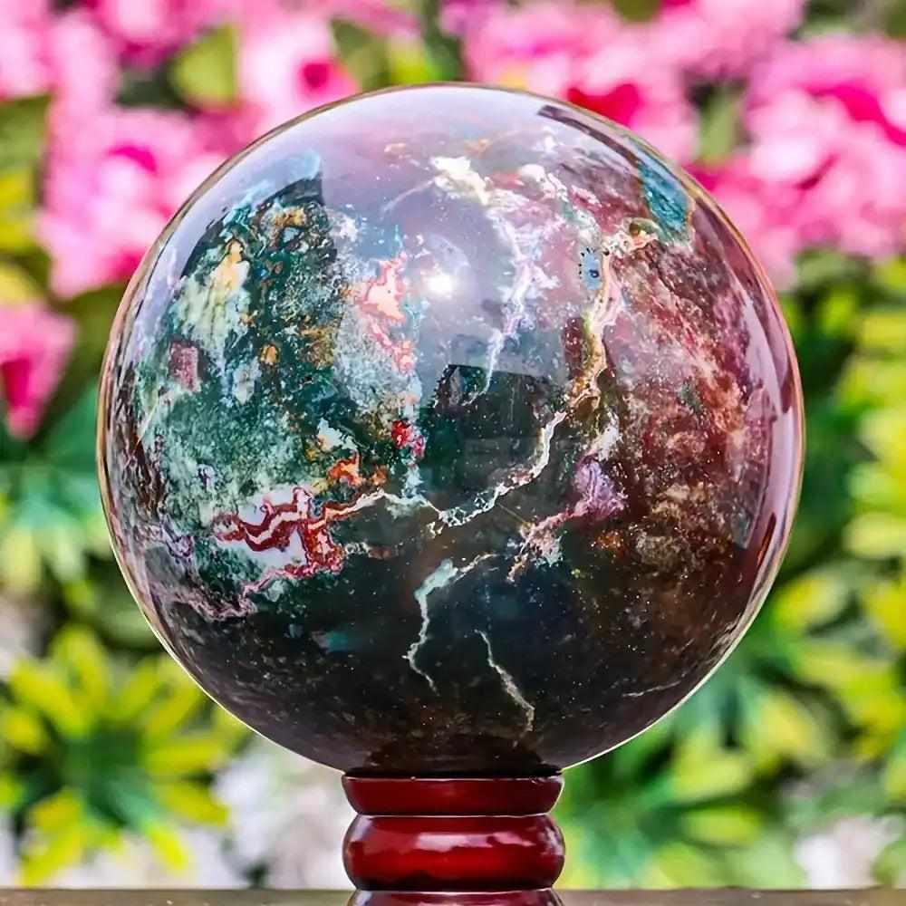 Large Ocean Jasper sphere featuring swirling green, pink, and blue orbs for calm, healing energy and meditation.